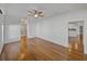 Bedroom with hardwood floors with views of the kitchen and en-suite bathroom at 5340 Nicklaus Dr, Winter Haven, FL 33884