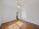 Bedroom with hardwood floors, ceiling fan, and white walls for a bright feel at 5340 Nicklaus Dr, Winter Haven, FL 33884