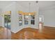 Light-filled breakfast nook with view of pool area and wooden flooring at 5340 Nicklaus Dr, Winter Haven, FL 33884