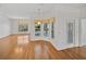 Breakfast nook with views of the pool area, wooden floors, and plenty of sunlight at 5340 Nicklaus Dr, Winter Haven, FL 33884