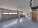 Spacious three-car garage with epoxy flooring and ample lighting at 5340 Nicklaus Dr, Winter Haven, FL 33884