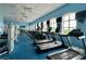 Bright gym with cardio equipment and large windows at 5340 Nicklaus Dr, Winter Haven, FL 33884