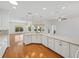 Bright open concept kitchen features granite countertops and wooden floors at 5340 Nicklaus Dr, Winter Haven, FL 33884