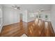 Open living room with hardwood floors, ceiling fans, and ample natural light, perfect for entertaining at 5340 Nicklaus Dr, Winter Haven, FL 33884
