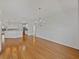 Spacious living room with gleaming hardwood floors and modern lighting fixtures at 5340 Nicklaus Dr, Winter Haven, FL 33884