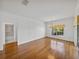 Bright living room with natural light, wooden floors, and neutral walls at 5340 Nicklaus Dr, Winter Haven, FL 33884