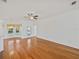 Bright living room featuring hardwood floors, and an open floor plan with access to the pool at 5340 Nicklaus Dr, Winter Haven, FL 33884