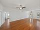 Expansive living room with hardwood floors, natural light, and seamless flow into other areas at 5340 Nicklaus Dr, Winter Haven, FL 33884