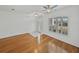 Well-lit living room featuring hardwood floors, large windows, and a comfortable atmosphere at 5340 Nicklaus Dr, Winter Haven, FL 33884