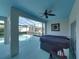 The covered patio has a hot tub and access to the screened-in pool and landscaped backyard at 5340 Nicklaus Dr, Winter Haven, FL 33884