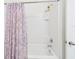Bathroom featuring a purple paisley patterned shower curtain at 5751 Lakeside Landings Blvd, Winter Haven, FL 33881