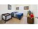 Well-lit bedroom features a large window and playful decor at 5751 Lakeside Landings Blvd, Winter Haven, FL 33881