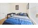 Comfortable bedroom with ample natural light, and carpeted floors at 5751 Lakeside Landings Blvd, Winter Haven, FL 33881