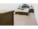 Bedroom with comfortable bed and stylish dresser with marble-style top at 5751 Lakeside Landings Blvd, Winter Haven, FL 33881