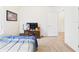 Bright bedroom with large window and carpeted floors at 5751 Lakeside Landings Blvd, Winter Haven, FL 33881