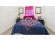 Comfortable bedroom featuring a plush bed and carpeted floors at 5751 Lakeside Landings Blvd, Winter Haven, FL 33881