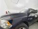 Garage featuring a full-size dark blue truck at 5751 Lakeside Landings Blvd, Winter Haven, FL 33881
