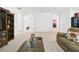 Spacious living room with neutral carpeting, ample seating, and arched doorways leading to other rooms at 5751 Lakeside Landings Blvd, Winter Haven, FL 33881