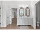 Bright bathroom features a double vanity with modern fixtures and neutral decor at 5820 E Johnson Ave, Haines City, FL 33844