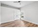 Well lit bedroom features beautiful flooring, a ceiling fan, a double door closet, and a window at 5820 E Johnson Ave, Haines City, FL 33844