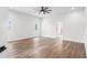 Spacious bedroom with hardwood floors, neutral walls, ceiling fan and natural light at 5820 E Johnson Ave, Haines City, FL 33844