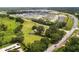 Aerial shot of the lot, showing the lush greenery, nearby roadways, and neighborhood at 5820 E Johnson Ave, Haines City, FL 33844