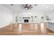 Spacious living room featuring a stone fireplace, French doors, and hardwood flooring at 5820 E Johnson Ave, Haines City, FL 33844