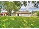 This lush backyard features mature trees and plenty of space for outdoor activities at 6028 Hillside Heights Dr, Lakeland, FL 33812