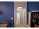 View of bathroom with colorful striped shower curtain through arched doorway at 6028 Hillside Heights Dr, Lakeland, FL 33812