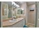 This bathroom has double sinks, great lighting and a beautifully tiled walk in shower at 6028 Hillside Heights Dr, Lakeland, FL 33812