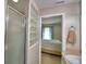 Bright bathroom with shower and a view into the bedroom at 6028 Hillside Heights Dr, Lakeland, FL 33812