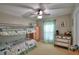 Bedroom features a bunk bed, dresser, and window with green-and-white curtains at 6028 Hillside Heights Dr, Lakeland, FL 33812