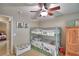 Bedroom featuring a bunk bed, dresser, and colorful decor and carpet at 6028 Hillside Heights Dr, Lakeland, FL 33812