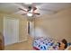 Bedroom with bed, closet, and connecting doorway view at 6028 Hillside Heights Dr, Lakeland, FL 33812