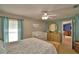 The Primary suite is bright and features a crib, dresser, and light colored walls at 6028 Hillside Heights Dr, Lakeland, FL 33812