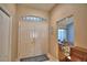 Bright foyer features a high ceiling, double front doors, and view into adjacent rooms at 6028 Hillside Heights Dr, Lakeland, FL 33812