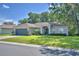 Beautiful single-story home featuring a landscaped front yard and covered front porch entrance at 6028 Hillside Heights Dr, Lakeland, FL 33812