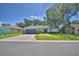 Charming single-story home with a well-manicured lawn and attached two-car garage at 6028 Hillside Heights Dr, Lakeland, FL 33812