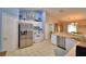 Spacious kitchen with stainless steel appliances, breakfast bar, and view to the dining area at 6028 Hillside Heights Dr, Lakeland, FL 33812