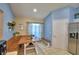 Bright eat-in kitchen with built-in bench seating, stainless refrigerator, and large window at 6028 Hillside Heights Dr, Lakeland, FL 33812