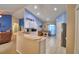 Open kitchen with breakfast nook, stainless appliances, and blue accent wall at 6028 Hillside Heights Dr, Lakeland, FL 33812