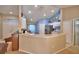 Bright kitchen with white cabinets, stainless steel refrigerator, and breakfast bar at 6028 Hillside Heights Dr, Lakeland, FL 33812