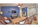 Comfortable living room featuring a ceiling fan and a large television at 6028 Hillside Heights Dr, Lakeland, FL 33812