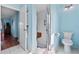 Bright bathroom with a walk-in shower featuring a fold-down seat at 6192 Magpie Dr, Lakeland, FL 33809