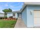 Charming single-story home with a well-manicured lawn and a two-car garage in a peaceful neighborhood at 6192 Magpie Dr, Lakeland, FL 33809