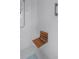 Close-up of a shower with a fold-down seat at 6192 Magpie Dr, Lakeland, FL 33809
