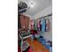 Walk-in closet with shelving, clothing, and storage containers at 6192 Magpie Dr, Lakeland, FL 33809
