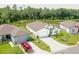 Inviting single-Gathering home features a lake view, well manicured landscaping, and spacious lawn at 6300 Dolostone Dr, Lakeland, FL 33811
