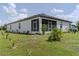 Expansive backyard with a screened-in lanai, perfect for outdoor relaxation and entertainment at 6300 Dolostone Dr, Lakeland, FL 33811