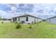 This backyard has immature landscaping, perfect for creating your own outdoor oasis at 6300 Dolostone Dr, Lakeland, FL 33811